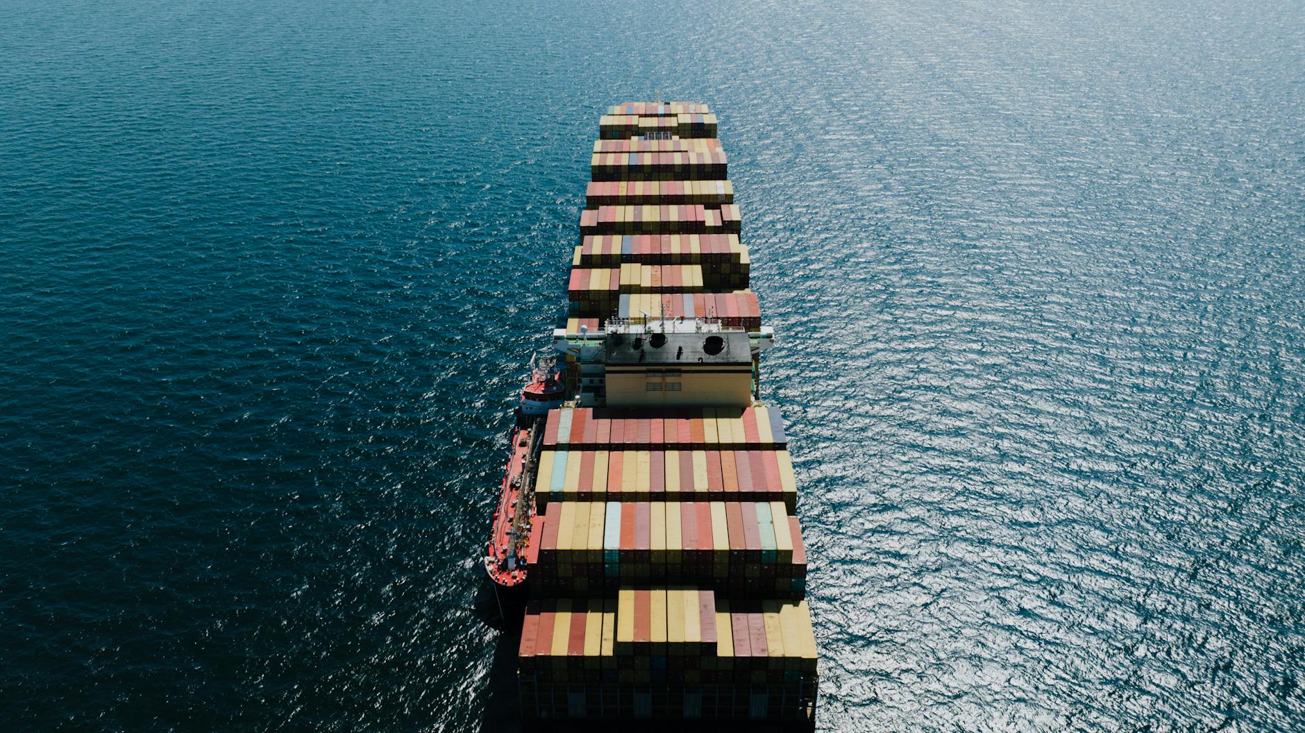 https://www.pexels.com/photo/fully-loaded-cargo-ship-on-a-sea-12530455/